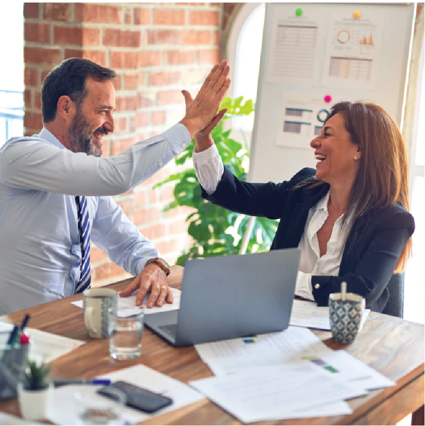 Man and Woman High Five in the office