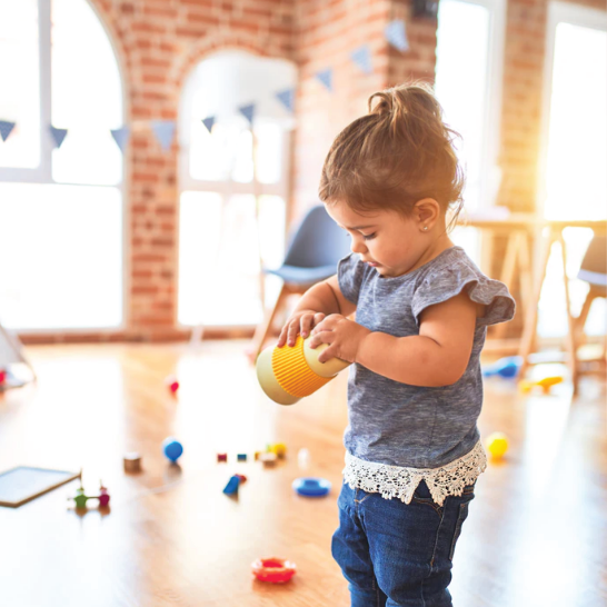 toddler holding toy