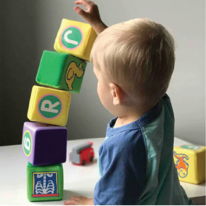young boy playing with blocks