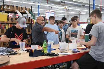 Nathan Smith, President of Elite Harness, provided Camp Hype students with a tour of their newly renovated production facility. Photo Credit: Photos by Ursula Goff