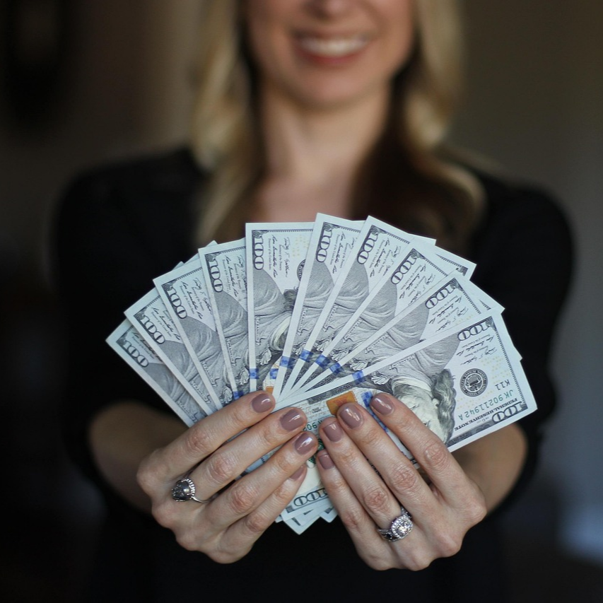 woman holding money